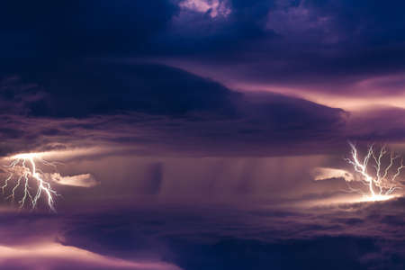Thunderstorms are massive clouds with thunder and lightning discharges in the skyの写真素材