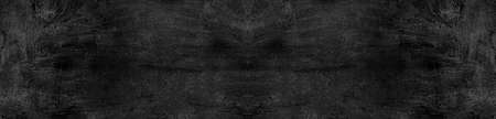 Vintage or grungy black background of natural cement or stone old texture as a retro pattern wall. It is a concept, conceptual or metaphor wall banner, grunge, material, aged, rust or construction.の写真素材