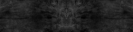 Vintage or grungy black background of natural cement or stone old texture as a retro pattern wall. It is a concept, conceptual or metaphor wall banner, grunge, material, aged, rust or construction.の写真素材