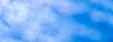 Blue abstract background with bokeh defocused lightsの写真素材