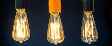 The sign of the world currency is inside of the retro lamps.の写真素材