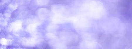 Purple abstract background with bokeh defocused lightsの写真素材