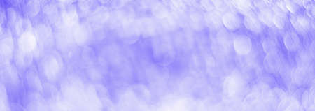 Purple abstract background with bokeh defocused lightsの写真素材