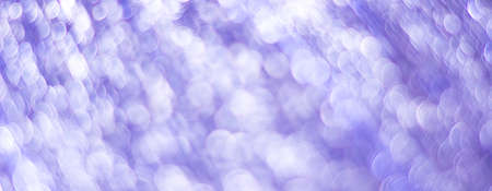 Purple abstract background with bokeh defocused lightsの写真素材