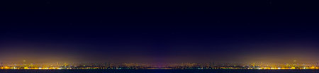 Spectacular nighttime skyline of a big modern city at night.の写真素材
