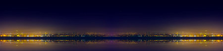 Spectacular nighttime skyline of a big modern city at night.の写真素材