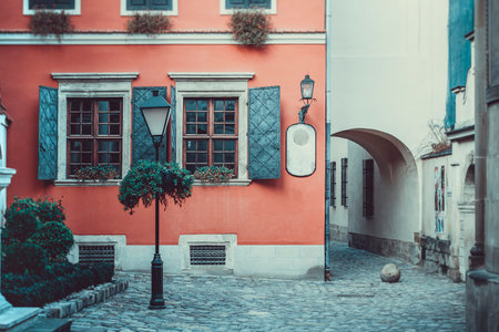 Old windows on the background of an orange wall in the old courtyard of the city.の写真素材