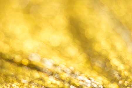 Gold bokeh. Abstract background. Defocused lights.