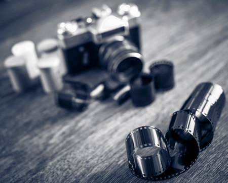 Retro photo camera on a wooden table. vintage style.