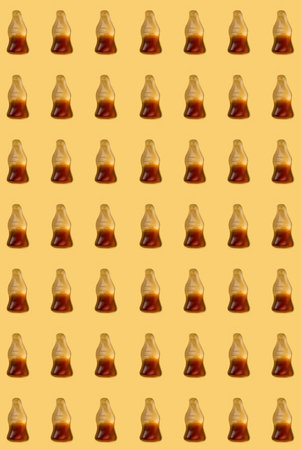 Cola jelly pattern  on yellow background , candyの写真素材