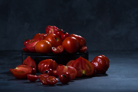 tomatoes  composition on black isolated  background ,  many
 brandの写真素材