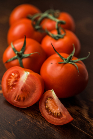 Fresh tomatoes on rustic wooden backgroundの写真素材