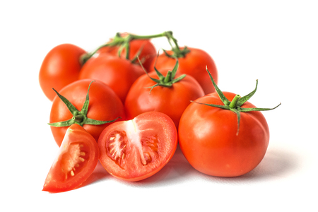 Fresh red tomatoes on white isolated backgroundの写真素材
