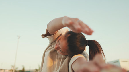 Asian girl in sportswear does workout, stretching and gymnastics on modern buildings backgroundの写真素材