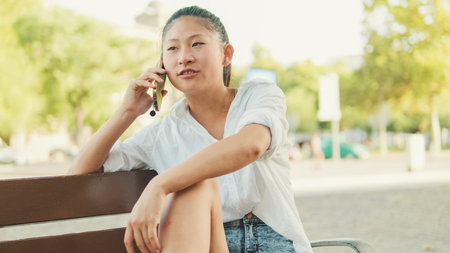 Close up of young woman talking on cell phoneの写真素材