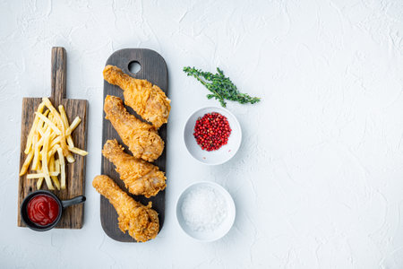 Chicken leg breaded and fried on white background, top view, with space for text.の写真素材