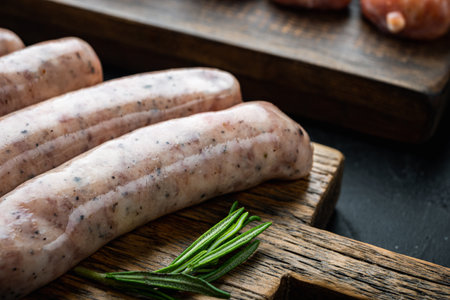 Traditional mest sausages, on black background.の写真素材