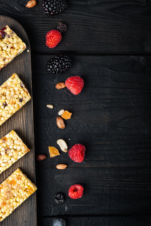 Healthy snacks, fitness lifestyle and fiber diet concept, top view with copy space, on black wooden tableの写真素材