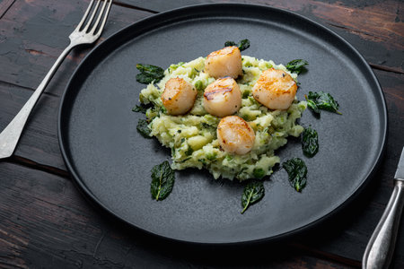 Sizzling seared scallops grilled meal, on dark wooden backgroundの写真素材
