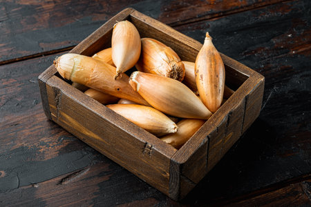Raw whole baby shallot onion, on old wooden tableの写真素材