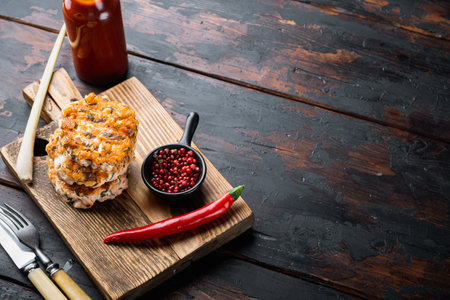 Grilled quick asian salmon cutlet, on old wooden table with space for textの写真素材