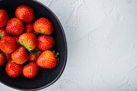Ripe red strawberry, top view with space for text, on white background.の写真素材