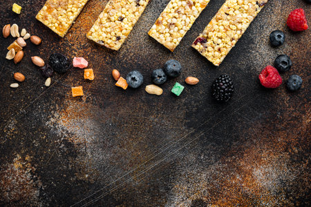 Healthy raw dessert snack. Fitness dietary food. Homemade breadsticks with flax, sunflower, pumpkin seeds , flat lay with space for text, on old dark tableの写真素材
