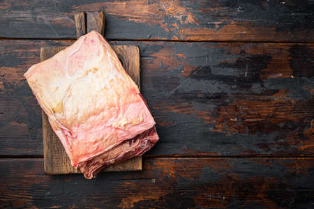Top loin, fresh organic beef meat cut, on old wooden table, top view, with copy space for textの写真素材