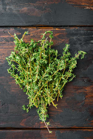 Thyme green fresh bunch, on old wooden table, top viewの写真素材