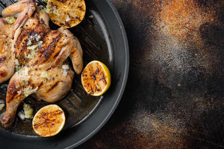 Roasted golden chicken, on old rustic background, top view with copy space for textの写真素材