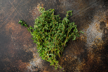 Thyme green bunch, on old rustic background, top view with copy space for text