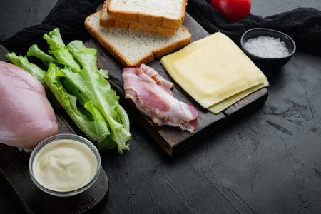 Fresh ingredient for tasty sandwich, on black background with copy space for textの写真素材