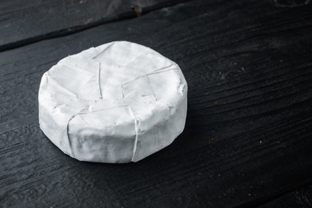 Farm cheese camembert set, on black wooden background with copy space for text