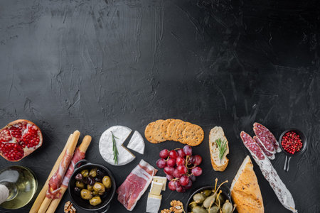 Ingredients for spanish food, meat cheede, herbs set, on black background, top view with copy space...