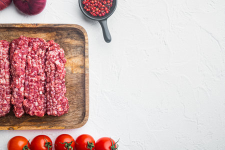 Organic Raw Grass Fed, Ground Beef, on white background, top view flat lay with copy space for textの写真素材