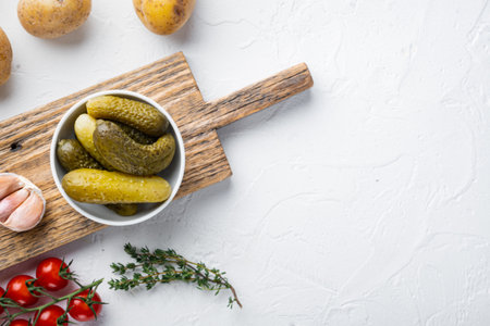 Homemade canning. Marinated cucumbers gherkins set, on white background, top view flat lay, with space for text copyspaceの写真素材