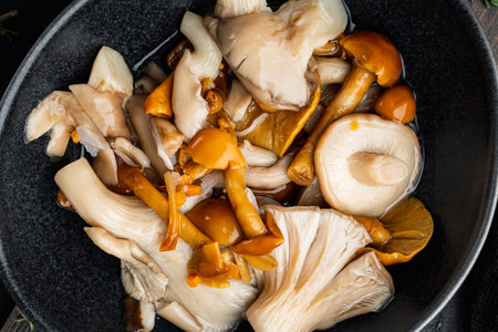 Pickled mushrooms set, on black background, top view flat layの写真素材
