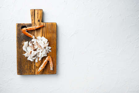 Thai blue swimming crab boiled meat parts set, on wooden cutting board, on white background, top view flat lay, with copyspace and space for textの写真素材