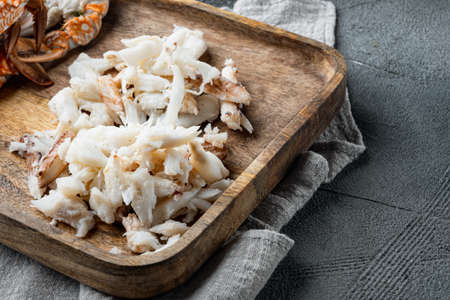 Mixed brown white crabmeat boiled, on gray background, with copyspace and space for textの写真素材