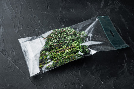 Fresh juicy Thyme in market pack set, on black backgroundの写真素材