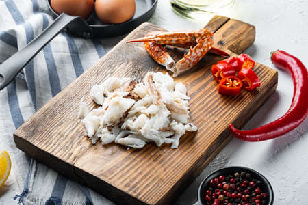 Ingredients for breakfast omelette with crab meat and cheese set, on white backgroundの写真素材