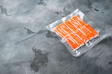 Crab stick surimi vacuum pack set, on gray background, with copyspace and space for textの写真素材