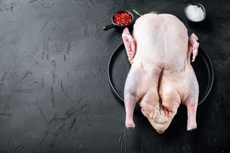 Recipe for cooking whole duck meat on black background, with space for text.の写真素材