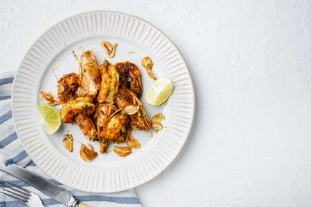 Sticky Mango Prawns or shrimps set, on plate, on white background, top view flat lay, with copyspace and space for textの写真素材