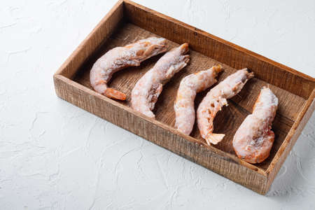 Langoustines argentine frozen set, in wooden box, on white background, with copyspace and space for textの写真素材