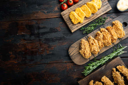 Korean barbeque fried chicken cuts on old dark wooden table, top view, with copy space.の写真素材