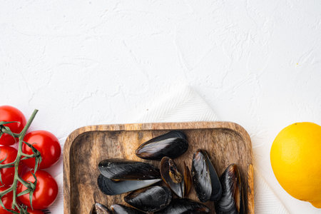 Mussels, molluscs, seaweed, sea plants with spices set, on wooden tray, on white background, top view flat lay, with copyspace and space for textの写真素材