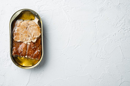 Canned Smoked Trout Fillets set, in tin can, on white background, top view flat lay, with copyspace...