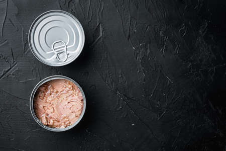 Canned soy free albacore white meat tuna set, in tin can, on black background, top view flat lay, with copyspace and space for textの写真素材