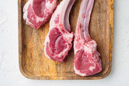 Lamb chops French trimmed set, on white stone background, top view flat layの写真素材
